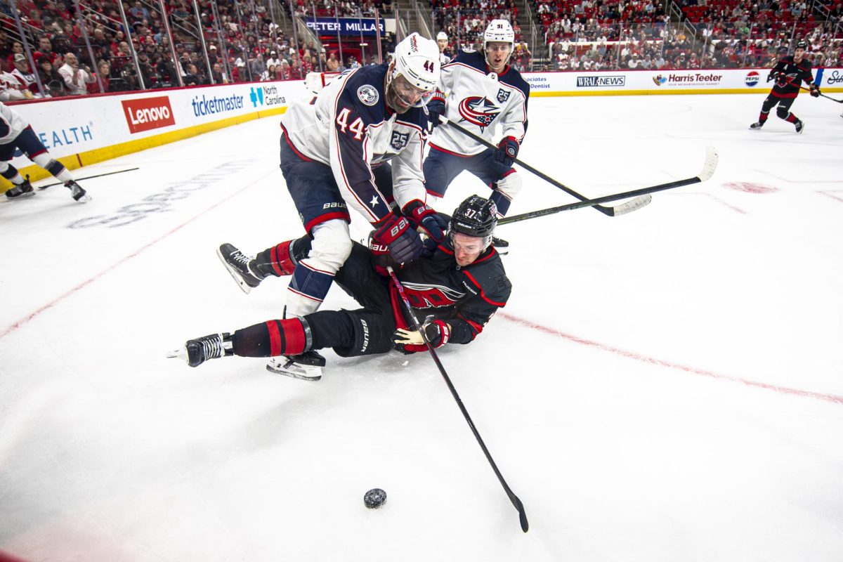 Hurricanes right-wing Andrei Svechnikov (37) is hounded by Columbus Blue Jackets defenders during the game in the Lenovo Center on Thursday, April 2, 2026. Carolina defeated Columbus 5-1.