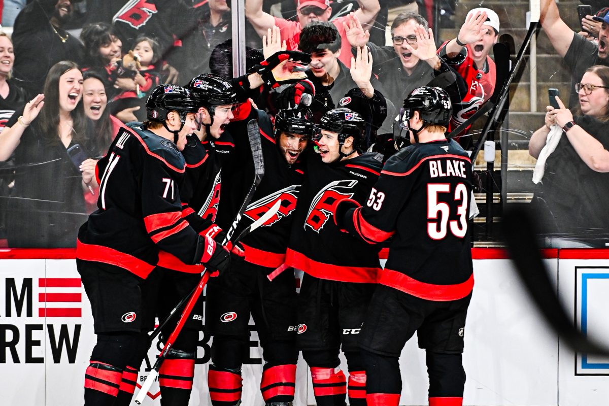 Hurricanes players celebrate after scoring a goal in the second period of Game One of the Eastern Conference Playoffs against the Ottawa Senators in the Lenovo Center on Saturday, April 18, 2026. The Hurricanes defeated the Senators 2-0.