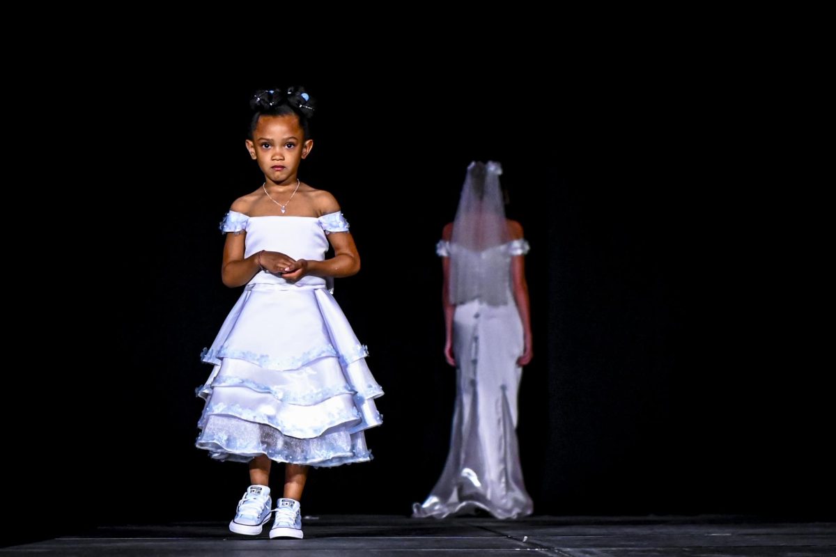A child model walks the runway during the Emerging Designers Runway Show and Textile Showcase at Talley State Ballroom on Saturday, April 25, 2026. This model is wearing a piece from the Abloom collection by designer Emma McDaniels.