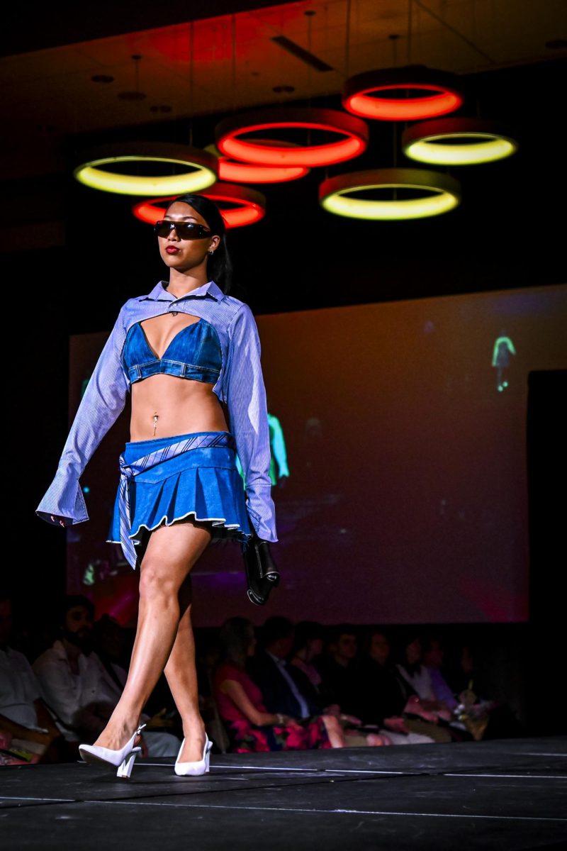 A model struts down the runway during the Emerging Designers Runway Show and Textile Showcase at Talley State Ballroom on Saturday, April 25, 2026. This model is wearing a piece from the Dress Code collection by Liv Glasgow, a fourth-year studying fashion and apparel design. 