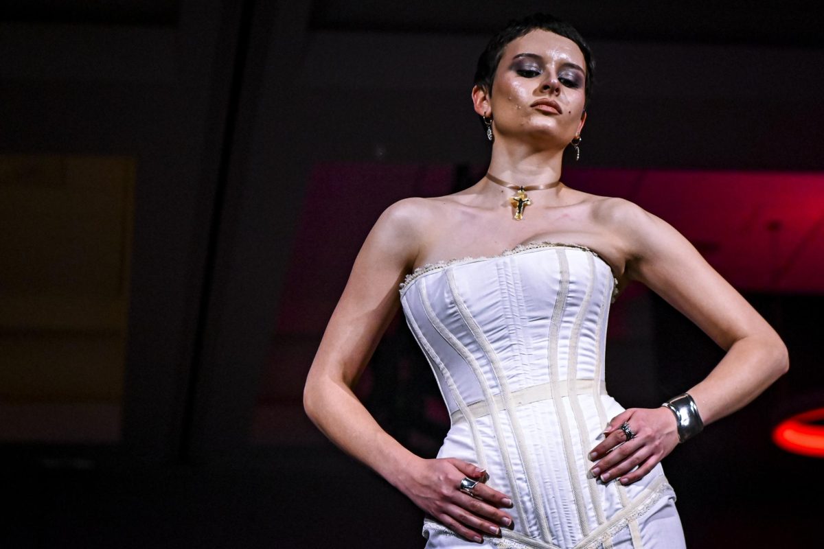 A model poses at the end of the runway during the Emerging Designers Runway Show and Textile Showcase at Talley State Ballroom on Saturday, April 25, 2026. This model is wearing a piece from the Glogotha collection by designer Hope Scarlett Faircloth.