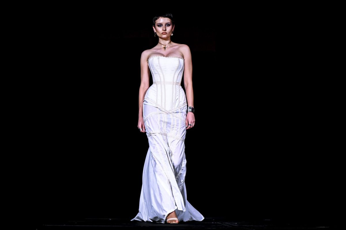 A model struts down the runway during the Emerging Designers Runway Show and Textile Showcase at Talley State Ballroom on Saturday, April 25, 2026. This model is wearing a piece from the Glogotha collection by designer Hope Scarlett Faircloth.