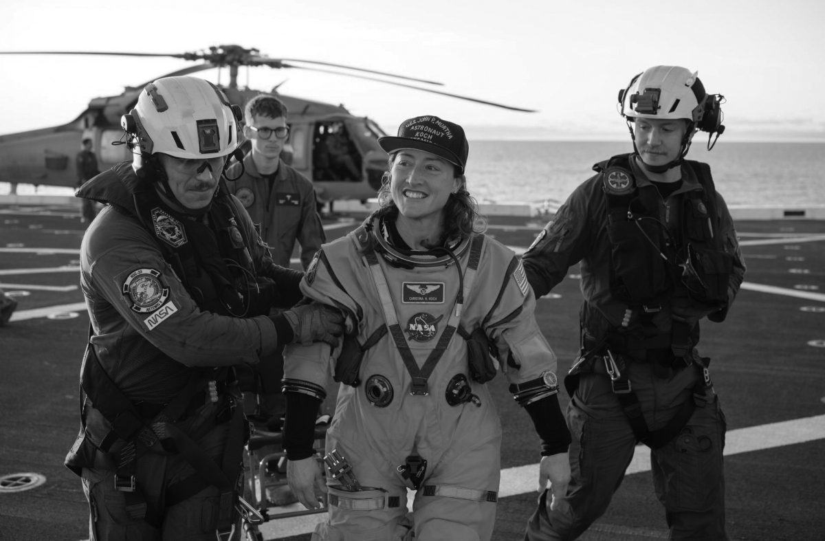 NASA astronaut Christina Koch, Artemis II mission specialist is assisted off the flight deck after arriving aboard USS John P. Murtha after she and fellow crewmates NASA astronauts Reid Wiseman, commander; Victor Glover, pilot; and CSA (Canadian Space Agency) astronaut Jeremy Hansen, mission specialist were extracted from their Orion spacecraft after splashdown, Friday, April 10, 2026, in the Pacific Ocean off the coast of California. NASA’s Artemis II mission took the quartet on a 10-day journey around the Moon and back to Earth. Following a splashdown at , NASA and U.S. military teams are working to bring the crewmembers and Orion spacecraft aboard the recovery ship.