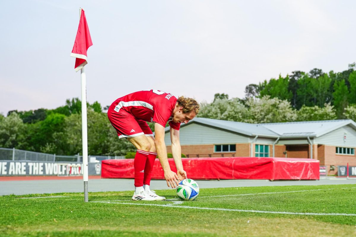 Senior midfielder Tyler Caton prepares to take a corner kick during the game against Wake Forest at Dail Soccer Field on Tuesday, April 7, 2026. NC State beat Wake Forest 3-0.