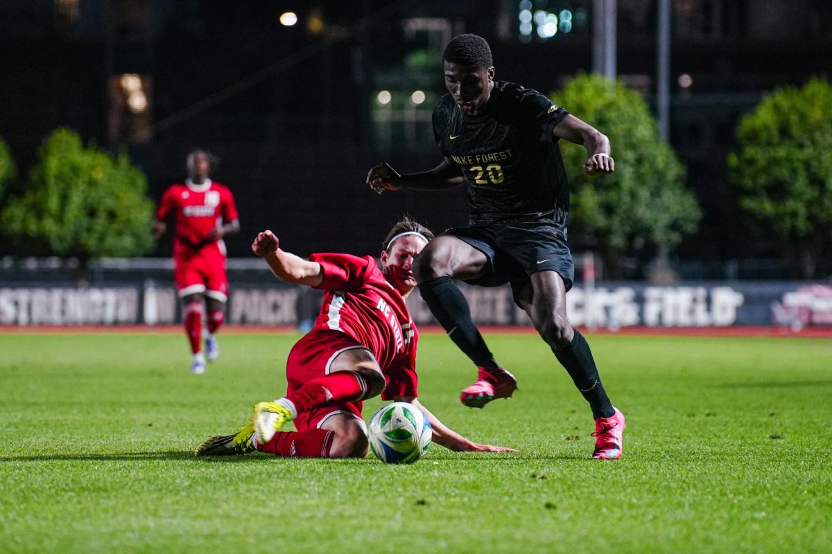 Sophomore defender Moritz Weber performs a slide tackle during the game against Wake Forest at Dail Soccer Field on Tuesday, April 7, 2026. NC State beat Wake Forest 3-0.