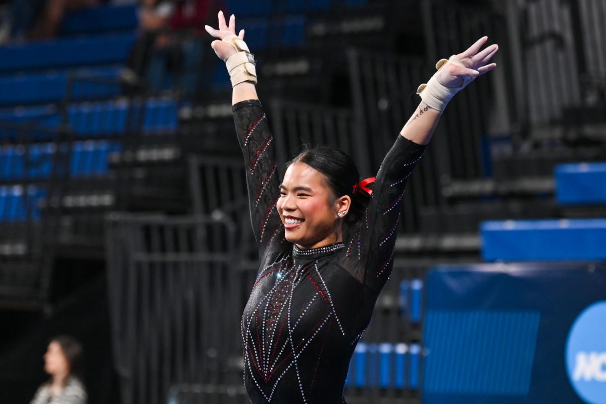 Junior Maddie Hall smiles after her vault routine at the NCAA Regional meet against Arkansas, Mizzou, and Maryland at Memorial Coliseum on Friday, Apr. 3, 2026. The Wolfpack fell to the Razorbacks and Tigers with a score of 195.700, marking the end of their 2026 season.
