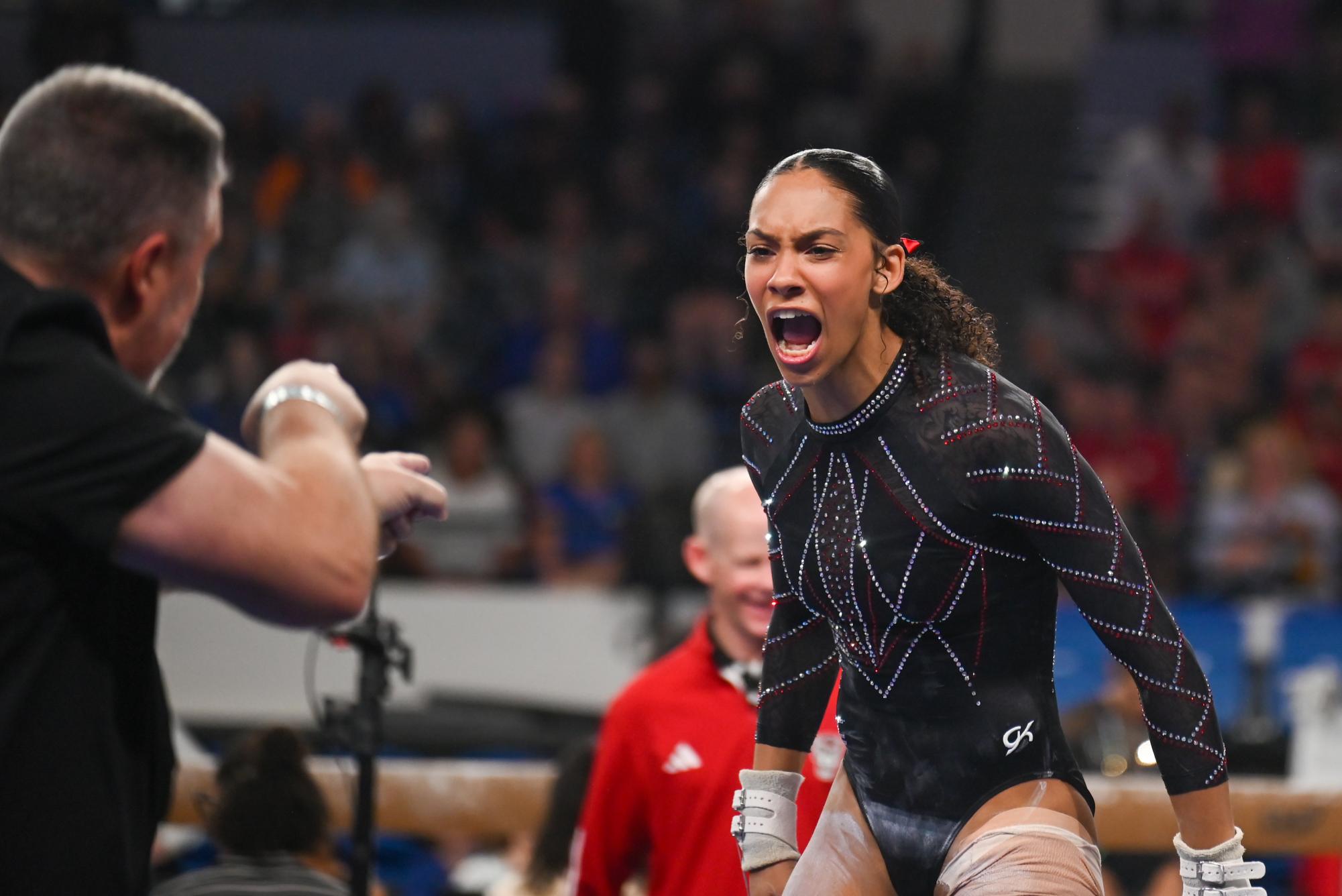 Sophomore Ava Myers yells after sticking her uneven bars dismount at the NCAA Regional meet against Arkansas, Mizzou, and Maryland at Memorial Coliseum on Friday, Apr. 3, 2026. The Wolfpack fell to the Razorbacks and Tigers with a score of 195.700, marking the end of their 2026 season.