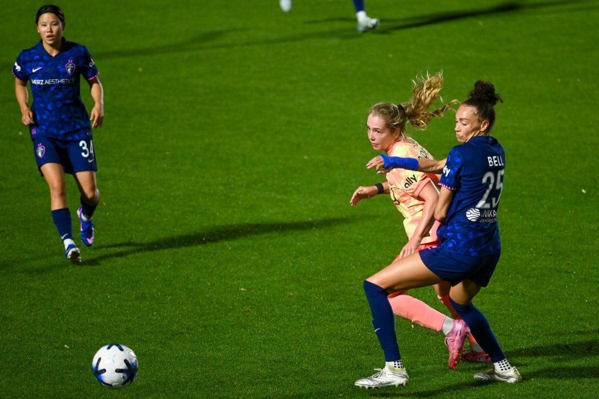 Defender Mayce Bell and forward Maddie Padelski fight for the ball during the match between the North Carolina Courage and Portland Thorns at First Horizon Stadium on Saturday, Apr. 4, 2026. Bell was the defensive force in this game and was named the Muscle and Hustle player of the match. Courage tied the thorns 2-2.