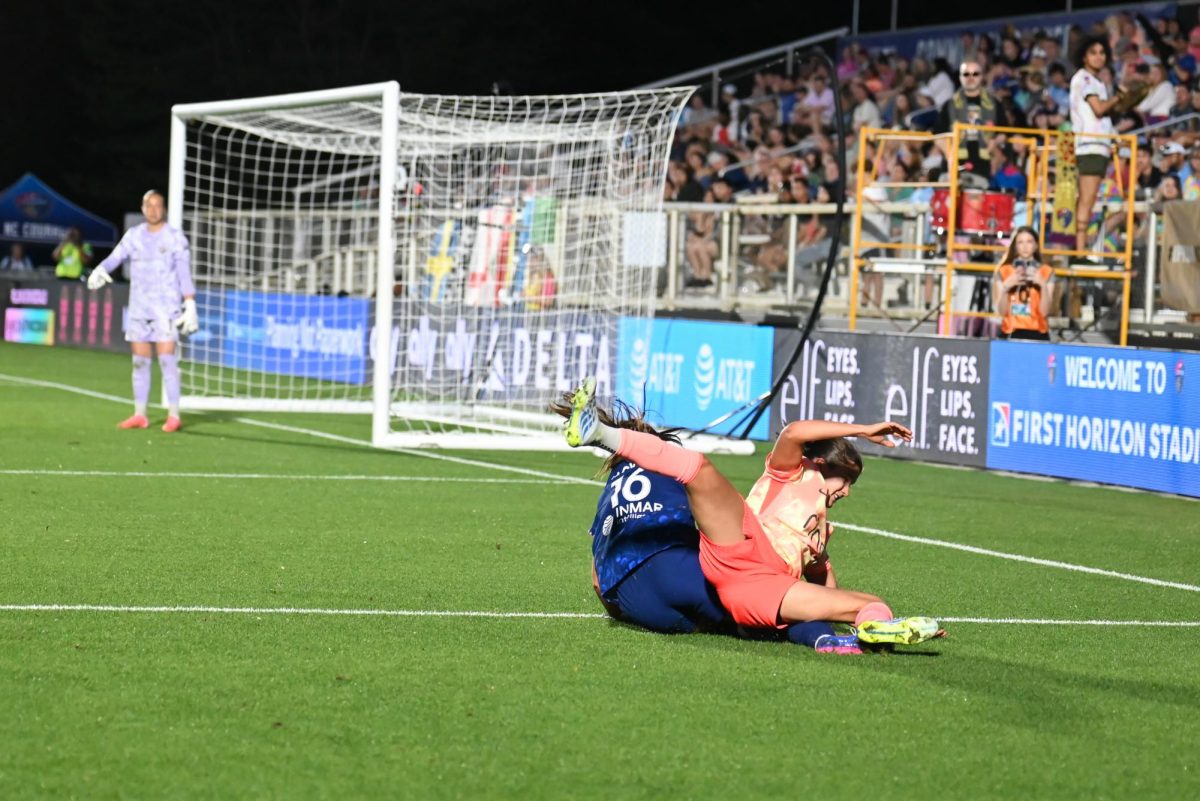 Midfielder Riley Jackson and Portland Thorns forward Piertra Tordin fall while fighting for the ball during the game between the North Carolina Courage and Portland Thorns at First Horizon Stadium on Saturday, Apr. 4, 2026. Courage tied the thorns 2-2.