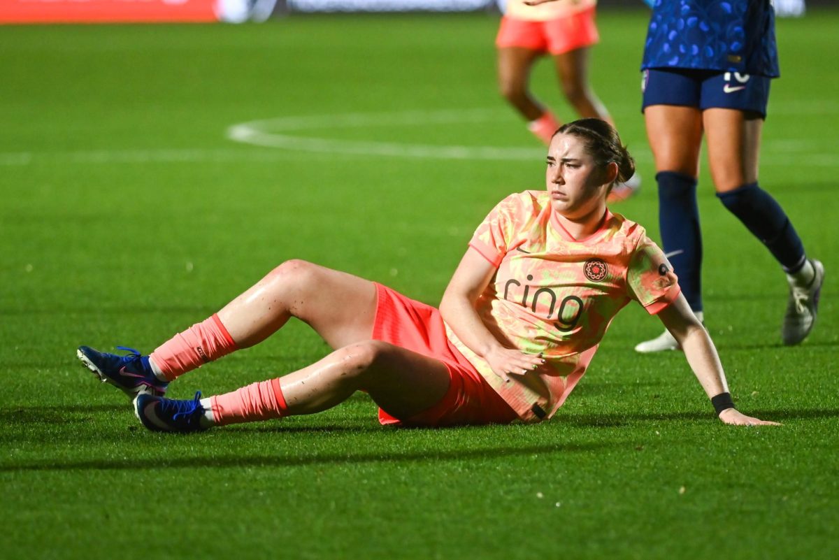 Midfielder Olivia Moultrie lies on the ground after being fouled during the match between the North Carolina Courage and Portland Thorns at First Horizon Stadium on Saturday, Apr. 4, 2026. Courage tied the thorns 2-2.