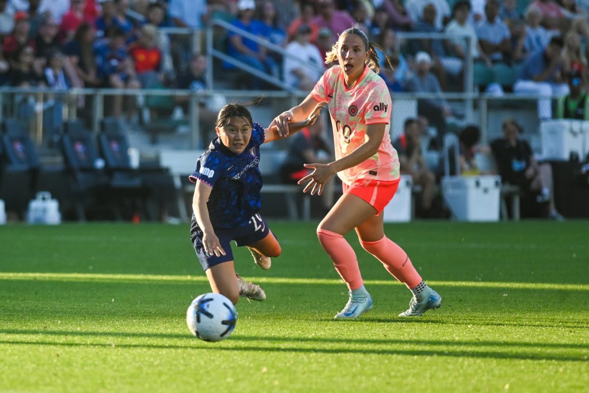 Portland Thorns Jayden Perry pushes defender Shinomi Koyama to the ground during the game between the North Carolina Courage and Portland Thorns at First Horizon Stadium on Saturday, Apr. 4, 2026. Courage tied the thorns 2-2.