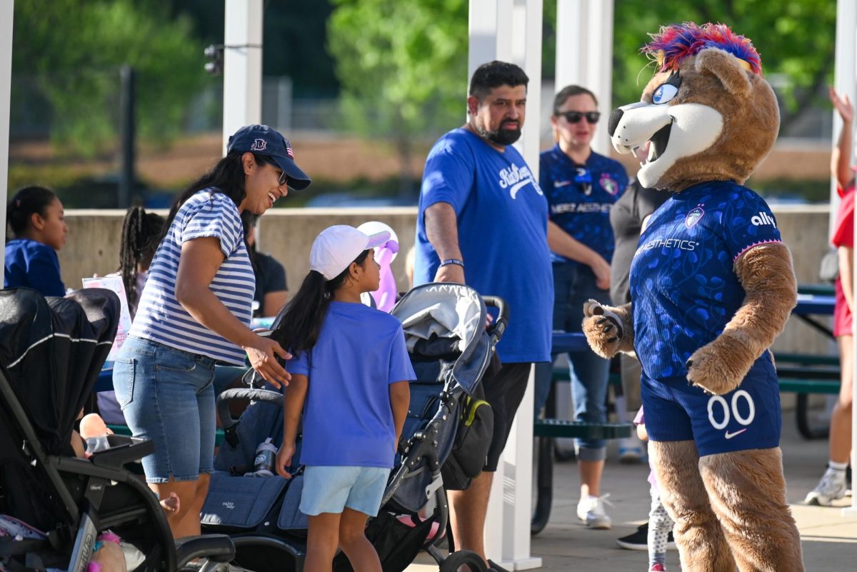 North Carolina Courage mascot Roary talks to fans before the game between the North Carolina Courage and Portland Thorns at First Horizon Stadium on Saturday, Apr. 4, 2026. Courage tied the thorns 2-2.