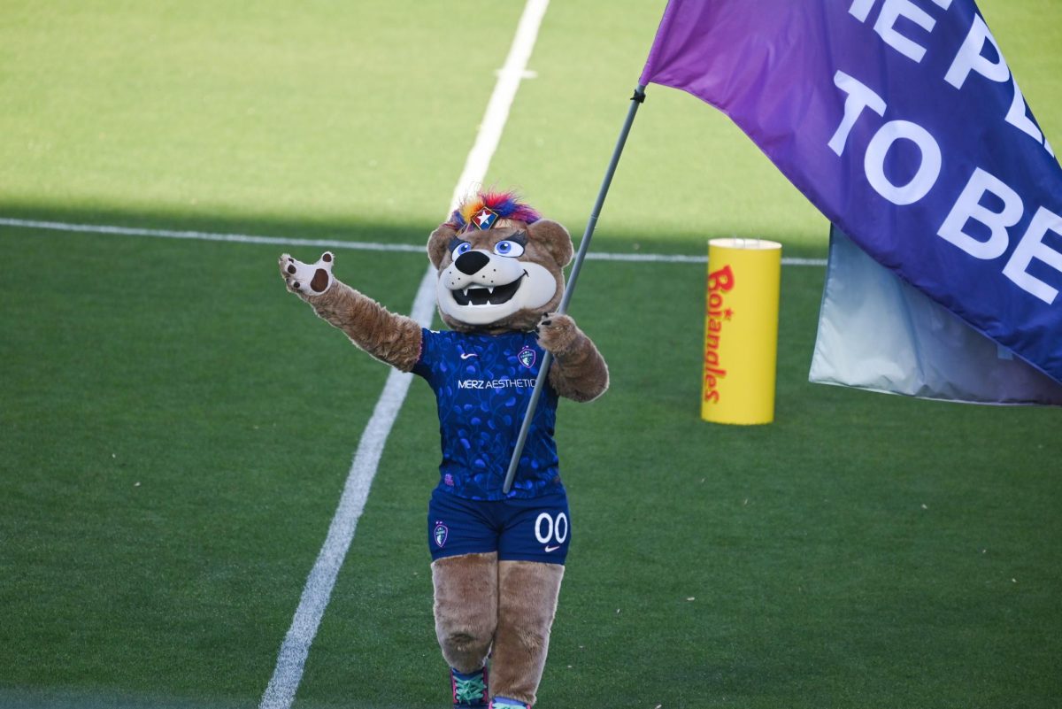 North Carolina Courage mascot Roary waves a flag before the game between the North Carolina Courage and Portland Thorns at First Horizon Stadium on Saturday, Apr. 4, 2026. Courage tied the thorns 2-2.