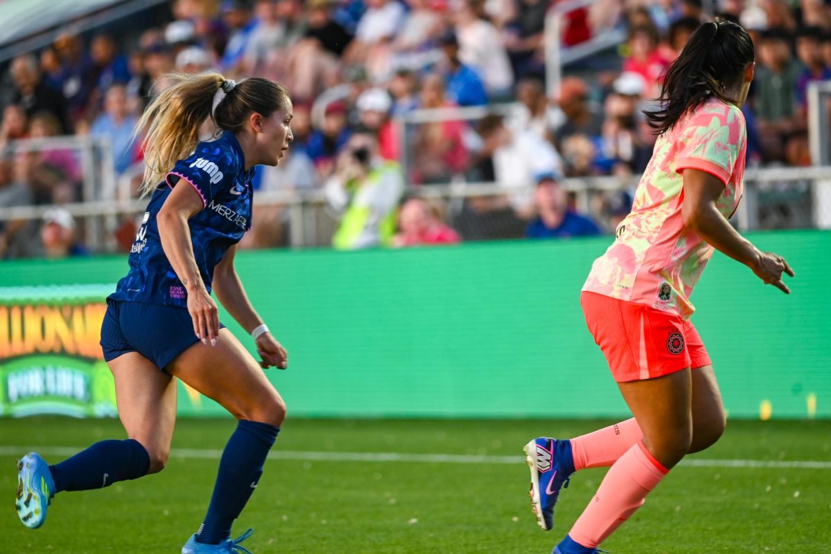 Midfielder Ashley Sanchez and Portland Thorns defender Sam Hiatt run for the ball during the game between the North Carolina Courage and Portland Thorns at First Horizon Stadium on Saturday, Apr. 4, 2026. Sanchez scored the equalizing goal. Courage tied the thorns 2-2.