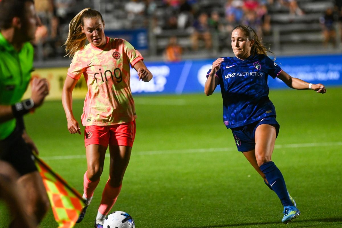 Midfielder Ashley Sanchez slides for the ball during the game between the North Carolina Courage and Portland Thorns at First Horizon Stadium on Saturday, Apr. 4, 2026. Sanchez scored the equalizing goal. Courage tied the thorns 2-2.