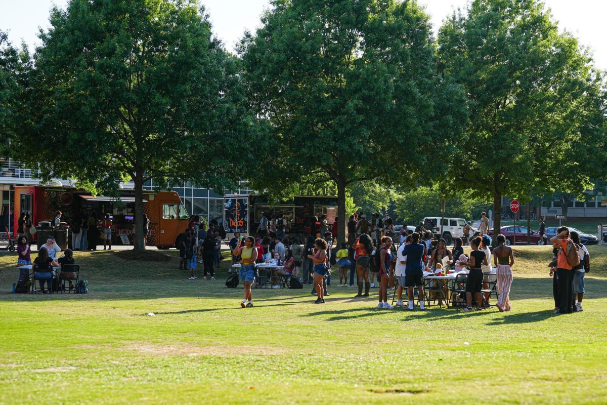 Students mingle and gather during the Pan-Afrikan Cookout at Harris Field on Thursday, April 16, 2026. The University Activities Board hosted the event in collaboration with the Black Students Board at N.C. State.