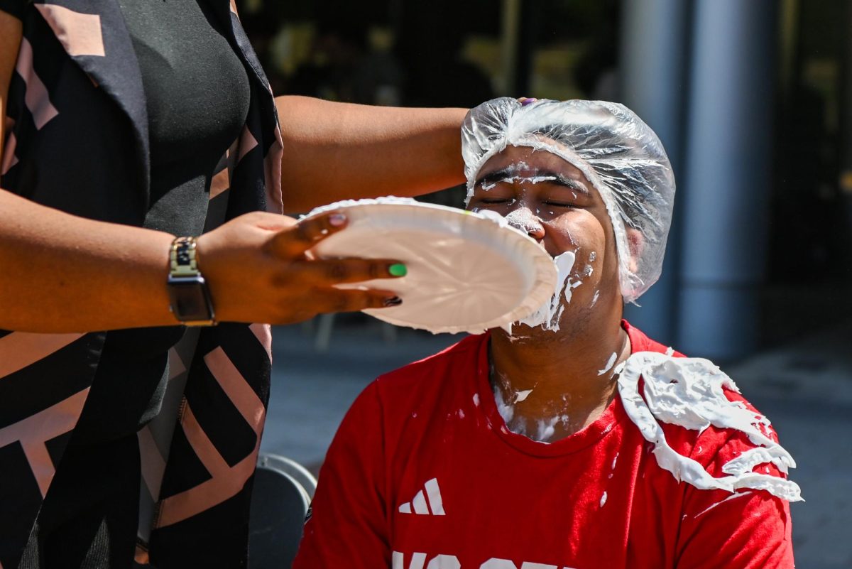 Justin Garrett, a fourth-year student studying political science, gets pied during the Pie BSB Eboard event at Stafford Commons on Tuesday, April. 17, 2026. The pie the Black Student Board Eboard event is part of Pan-African Week, a weeklong celebration of Pan-Africanism that promotes unity among students through fun activities designed for the black community.