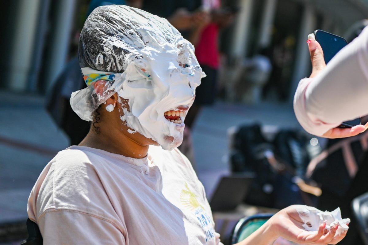 Gigi Davis, a third-year studying communications, smiles after getting pied during the Pie BSB Eboard event at Stafford Commons on Tuesday, April. 17, 2026. The pie the Black Student Board Eboard event is part of Pan-African Week, a weeklong celebration of Pan-Africanism that promotes unity among students through fun activities designed for the black community.