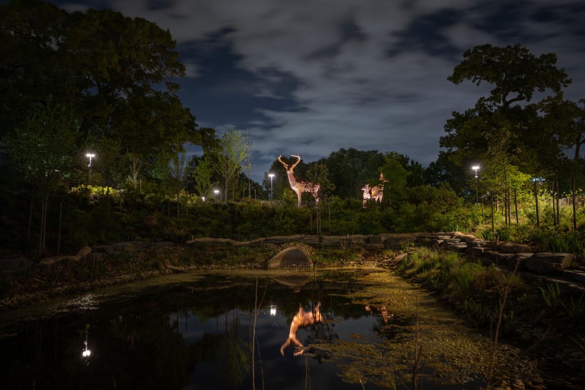 The Meadow of the Deer reflect in the pond as the night passes on April 5, 2026. The Meadow of the Deer was an art installation created by Mark Reigelman.