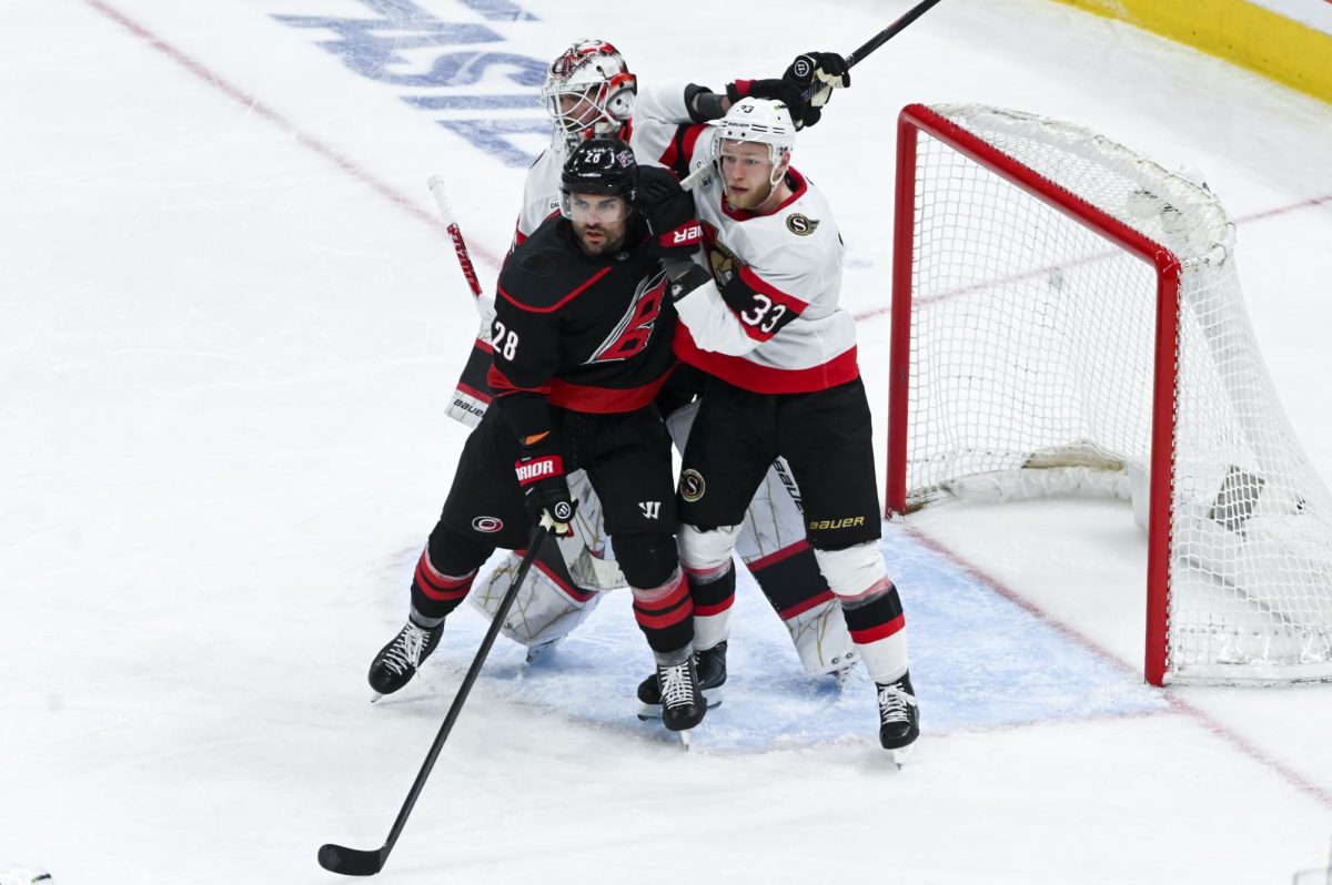 Left wing William Carrier battles an opponent during the round one playoff game versus the Ottawa Senators at the Lenovo Center on Monday, April 20, 2026. The Hurricanes beat the Senators 3-2 in double overtime.