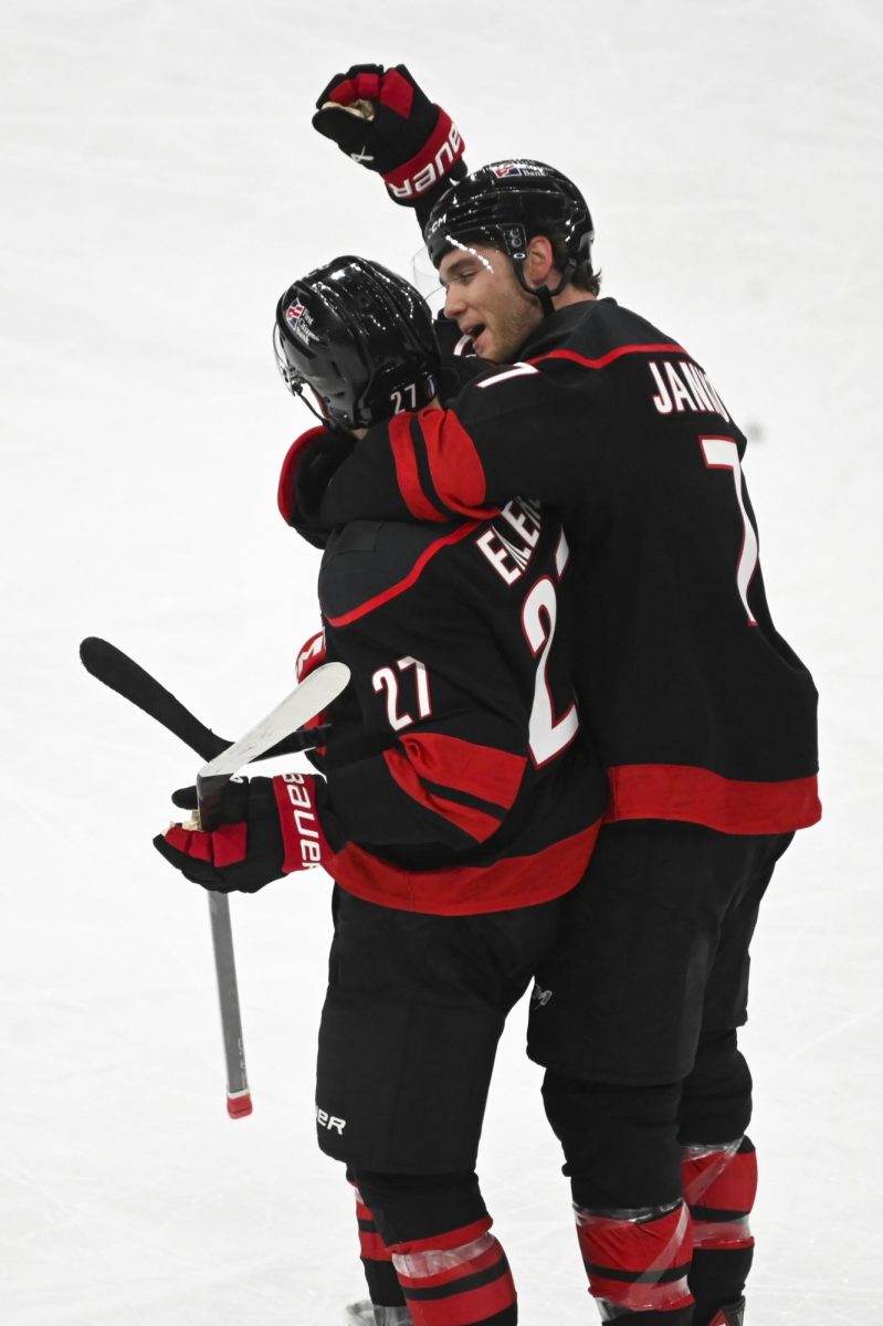 Left wingers Mark Jankowski and Nikolaj Ehlers celebrate after  the round one playoff game versus the Ottawa Senators at the Lenovo Center on Monday, April 20, 2026. The Hurricanes beat the Senators 3-2 in double overtime.