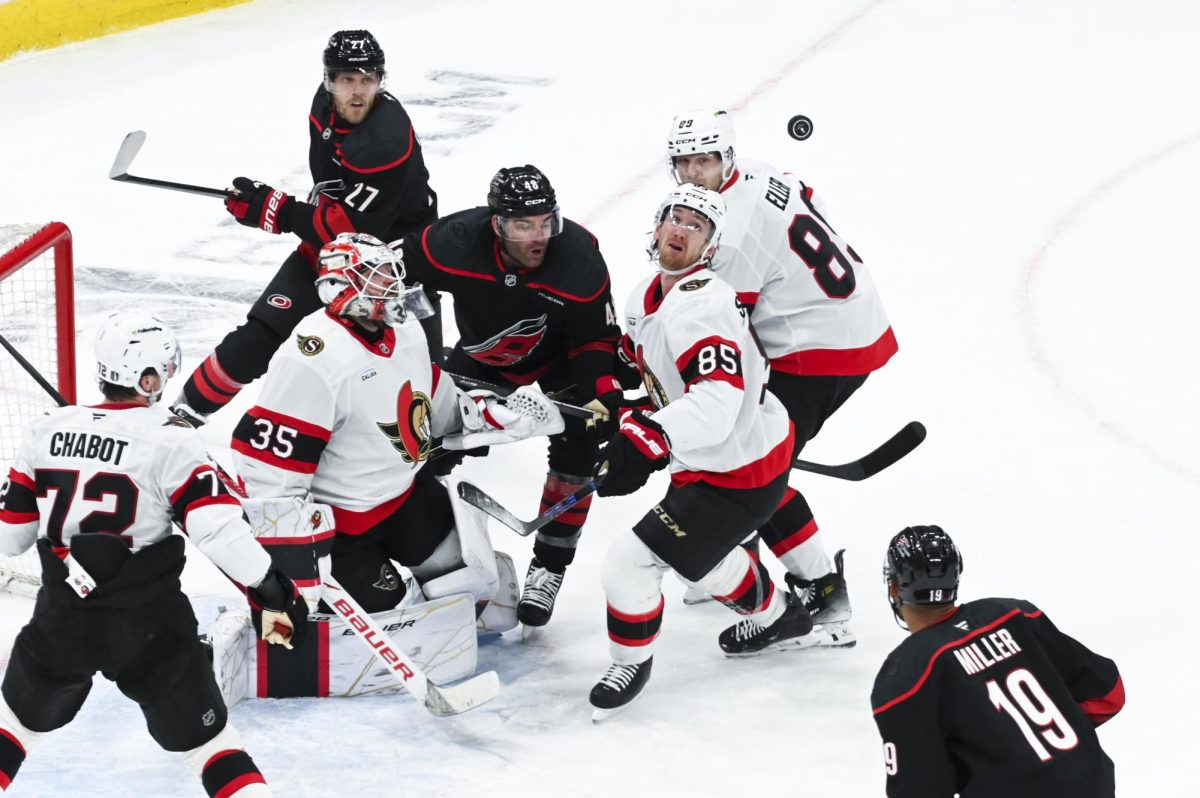 Left wingers Jordan Martinook and Nikolaj Ehlers watch the puck during the round one playoff game versus the Ottawa Senators at the Lenovo Center on Monday, April 20, 2026. Martinook scored one goal for the Hurricanes. The Hurricanes beat the Senators 3-2 in double overtime.