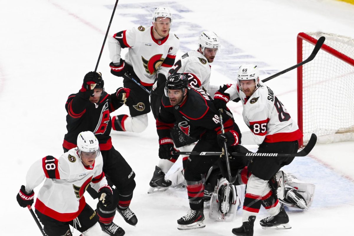 Center Jordan Staal and left wing Jordan Martinook guard the goal during the round one playoff game versus the Ottawa Senators at the Lenovo Center on Monday, April 20, 2026. Martinook scored one goal for the Hurricanes. The Hurricanes beat the Senators 3-2 in double overtime.