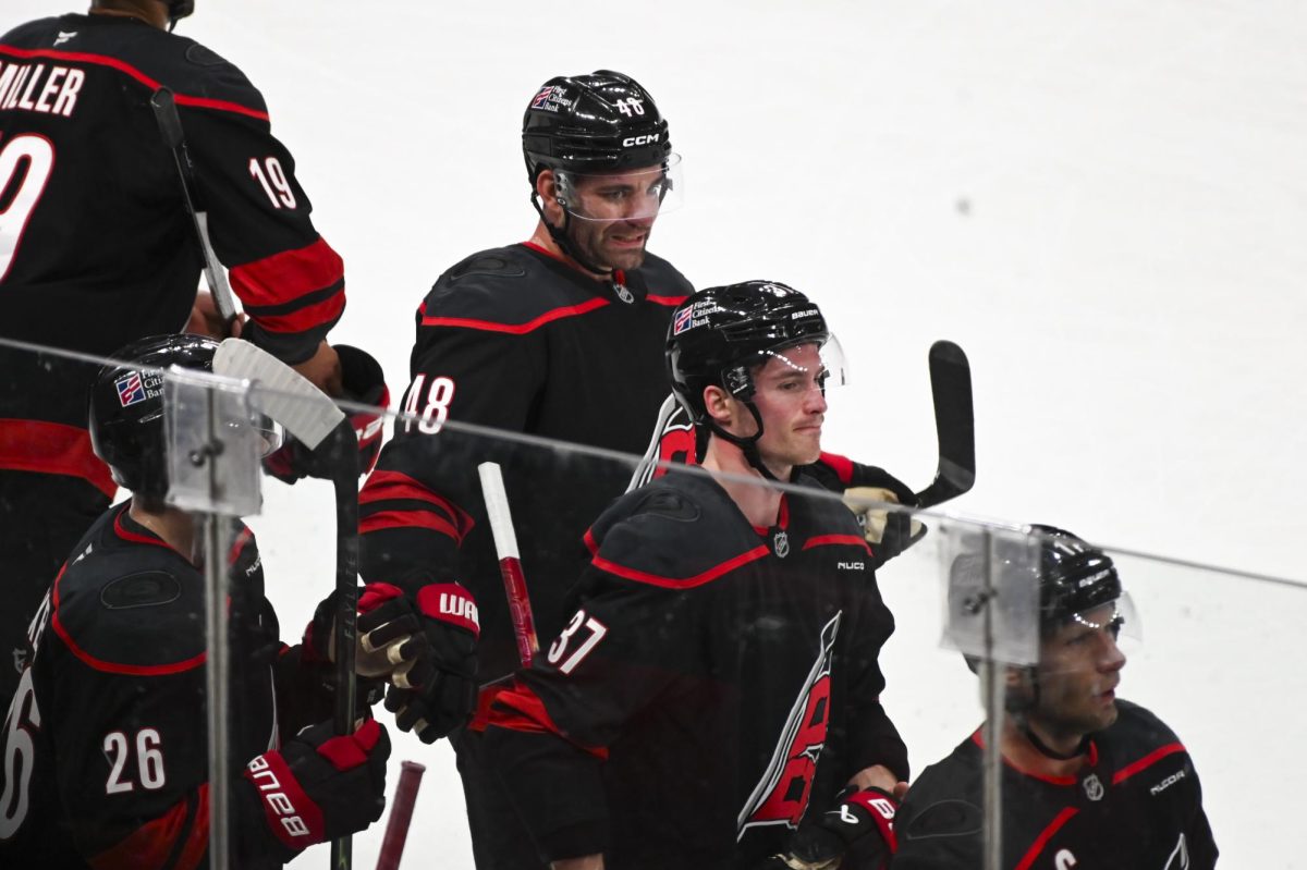 Left wing Jordan Martinook and right wing Andrei Svechnikov return to the bench during the round one playoff game versus the Ottawa Senators at the Lenovo Center on Monday, April 20, 2026. Martinook scored one goal for the Hurricanes. The Hurricanes beat the Senators 3-2 in double overtime.