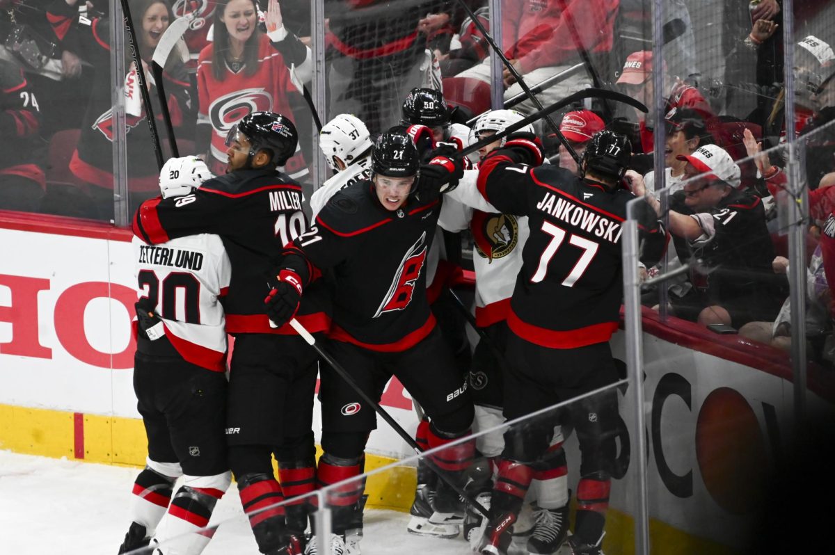 Defensemen K'Andre Miller and Alexander Nikishin and left wing Mark Jankowski battle opponents during the round one playoff game versus the Ottawa Senators at the Lenovo Center on Monday, April 20, 2026. The Hurricanes beat the Senators 3-2 in double overtime.