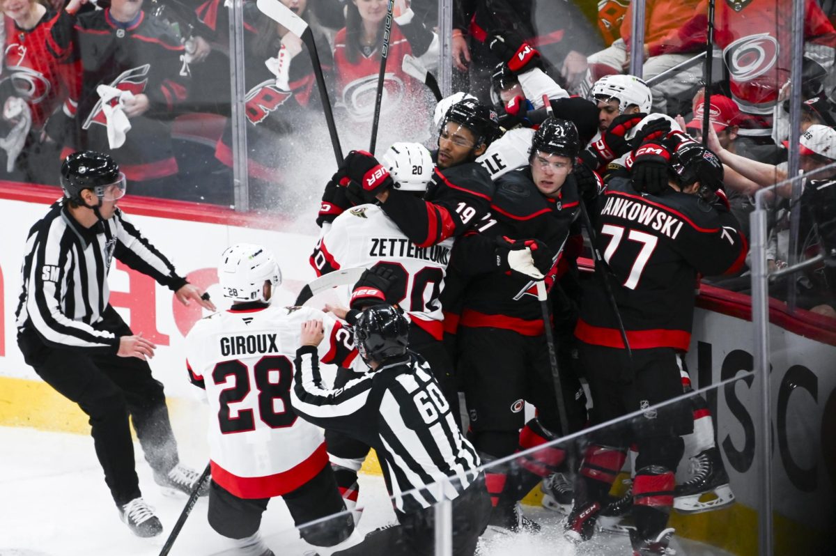 Defensemen K'Andre Miller and Alexander Nikishin and left wing Mark Jankowski battle opponents during the round one playoff game versus the Ottawa Senators at the Lenovo Center on Monday, April 20, 2026. The Hurricanes beat the Senators 3-2 in double overtime.