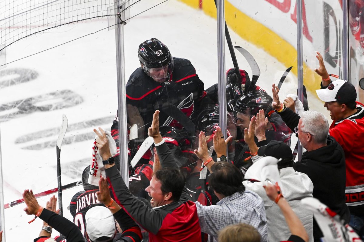 Hurricanes players celebrate after winning the round one playoff game versus the Ottawa Senators at the Lenovo Center on Monday, April 20, 2026. The Hurricanes beat the Senators 3-2 in double overtime.