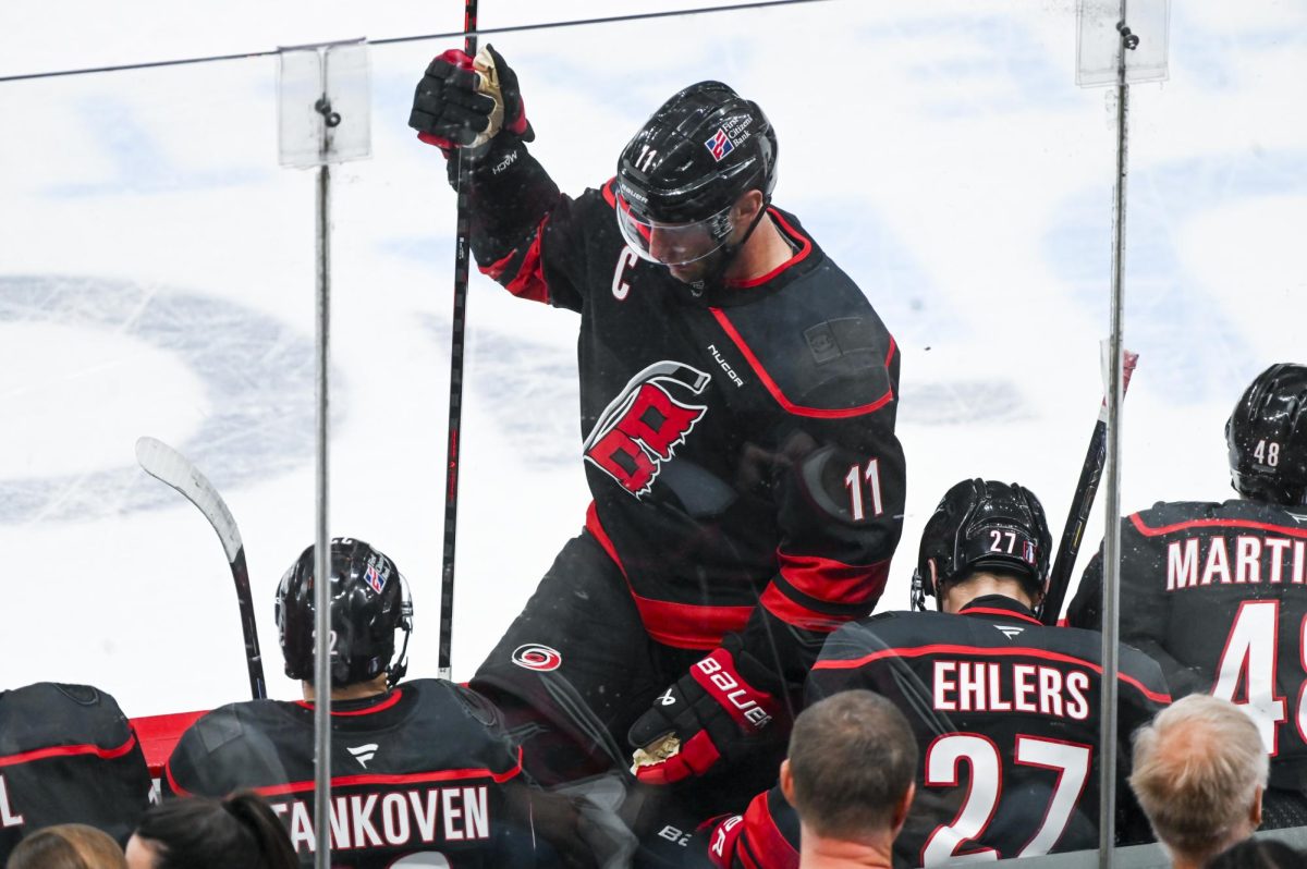 Center Jordan Staal climbs onto the bench during the round one playoff game versus the Ottawa Senators at the Lenovo Center on Monday, April 20, 2026. The Hurricanes beat the Senators 3-2 in double overtime.