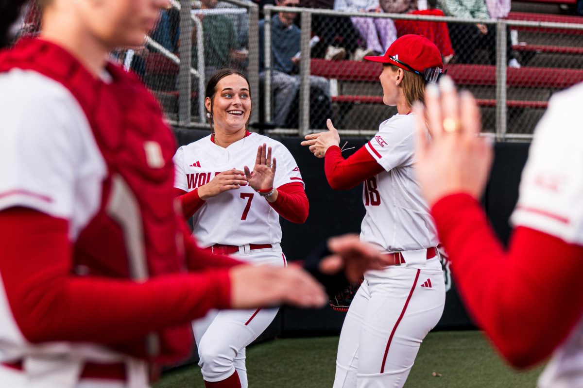 Redshirt junior right-handed pitcher Wynne Gore and junior outfielder Sarah Johnson point at each other before the game against Arizona State at Dail Softball Stadium on Wednesday, March 25, 2026. The Wolfpack fell to the Sun Devils 7-3.