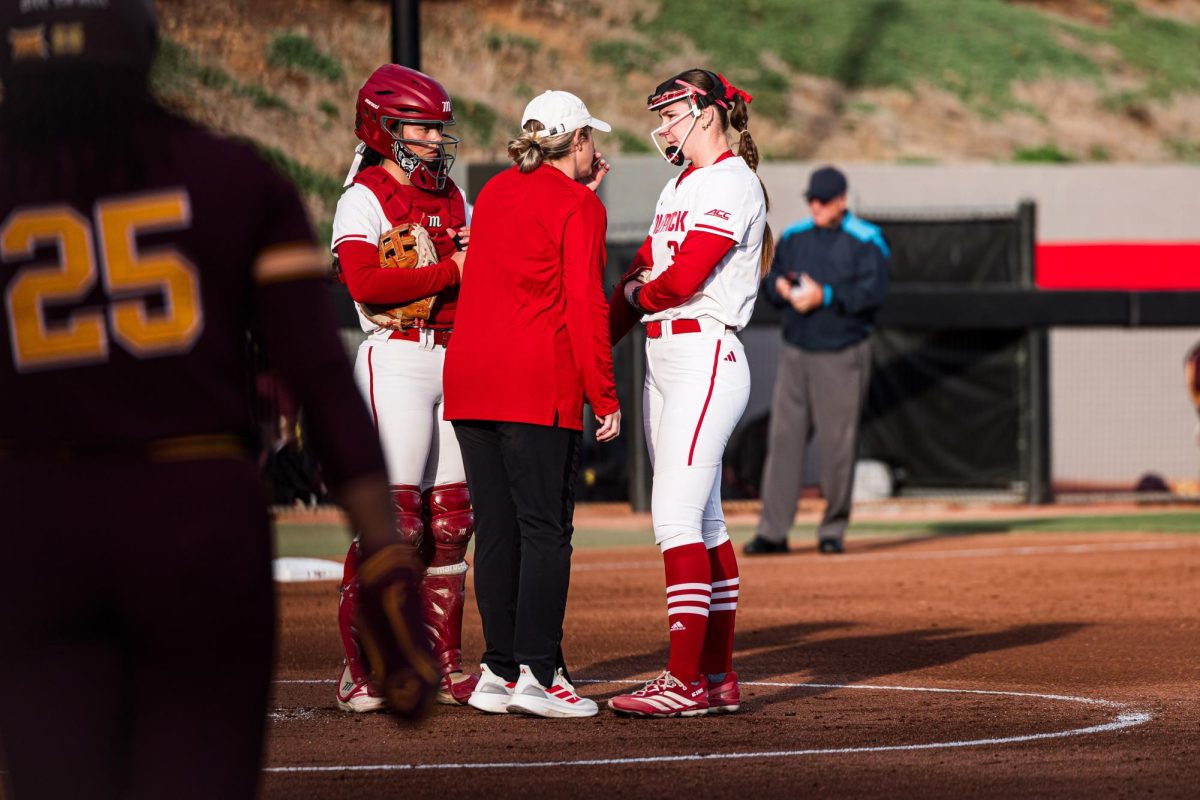 Freshman utility Morgan Talley speaks with Assistant Coach Paige Cassady during the game against Arizona State at Dail Softball Stadium on Wednesday, March 25, 2026. The Wolfpack fell to the Sun Devils 7-3.