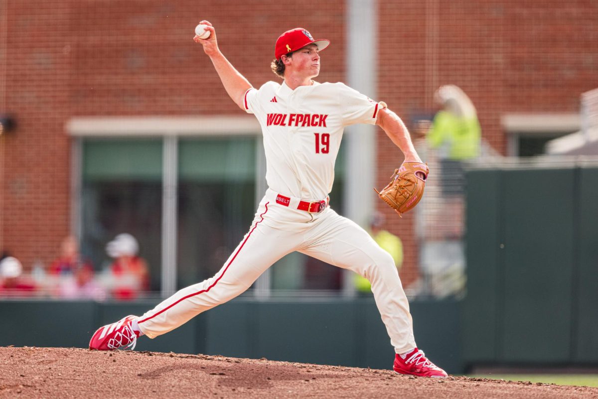 Junior right-handed pitcher Heath Andrews winds up to throw a pitch during the game against Duke at Doak Field at Dail Park on Saturday, April 11, 2026. Andrews pitched 6.2 innings and got six strikeouts. The Wolfpack defeated the Blue Devils 18-5.