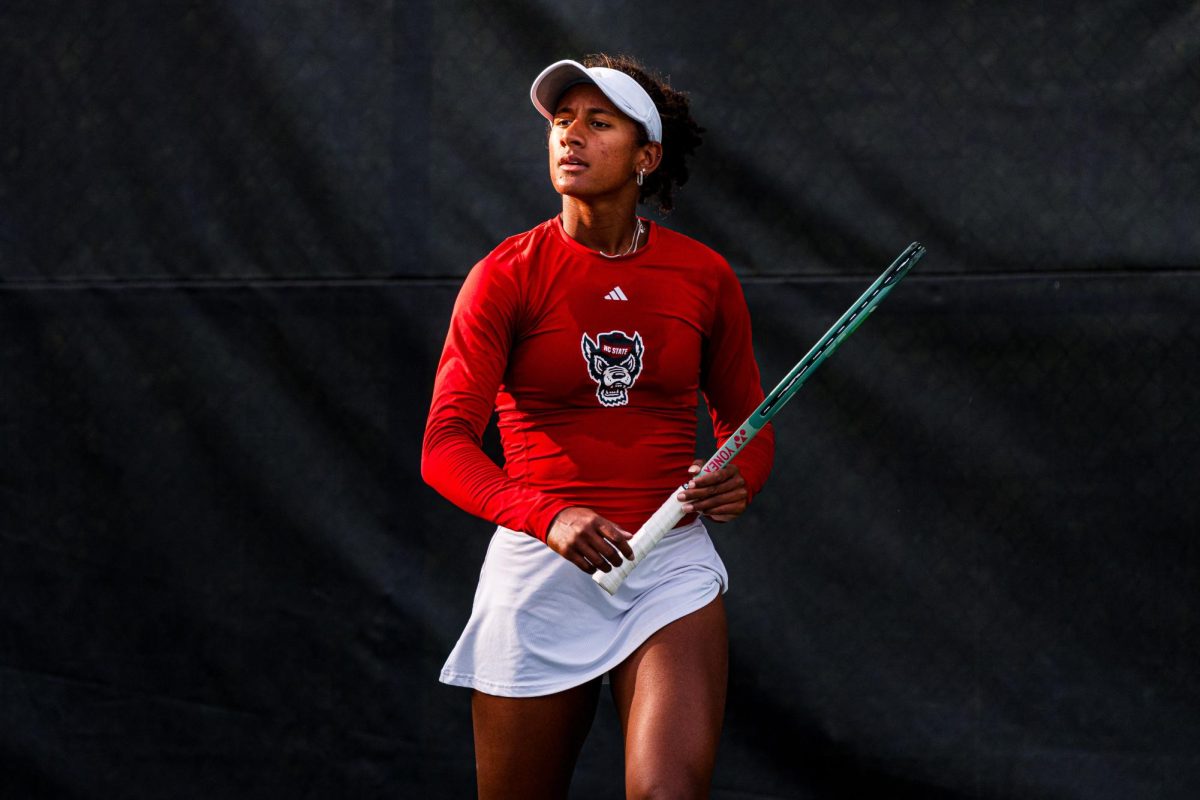 Freshman Victoria Osuigwe walks back to the bench after winning the set during the match against Duke at Cary Tennis Park on Wednesday, April 8, 2026. Osuigwe won her singles match 6-3,6-3. The Wolfpack fell to the Blue Devils 3-4.