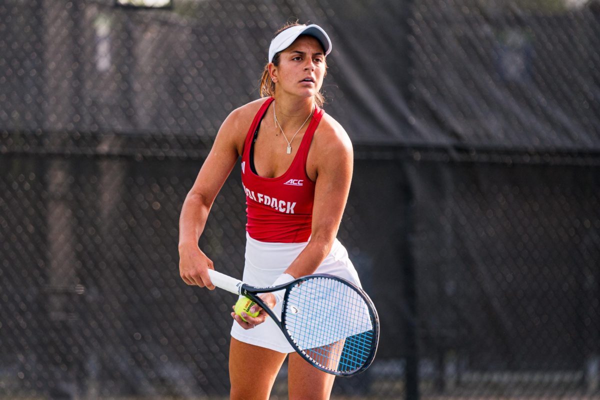 Freshman Lavinia Tanasie waits to serve the ball during her match against Duke at Cary Tennis Park on Wednesday, April 8, 2026. Tanasie won her singles match 6-4,6-3. The Wolfpack fell to the Blue Devils 3-4.