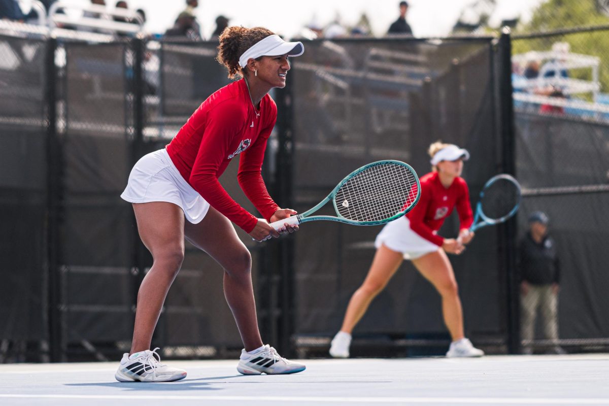 Freshman Victoria Osuigwe and junior Gabriella Braodfoot wait for the ball to be served during their doubles match against Duke at Cary Tennis Park on Wednesday, April 8, 2026. The Wolfpack fell to the Blue Devils 3-4.