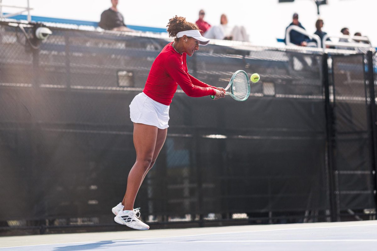 Freshman Victoria Osuigwe jumps to hit the ball during the match against Duke at Cary Tennis Park on Wednesday, April 8, 2026. Osuigwe won her singles match 6-3,6-3. The Wolfpack fell to the Blue Devils 3-4.