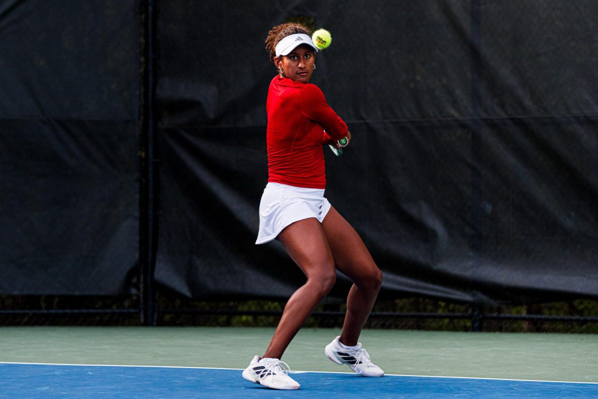 Freshman Victoria Osuigwe watches before swinging at the ball during the match against Duke at Cary Tennis Park on Wednesday, April 8, 2026. Osuigwe won her singles match 6-3,6-3. The Wolfpack fell to the Blue Devils 3-4.