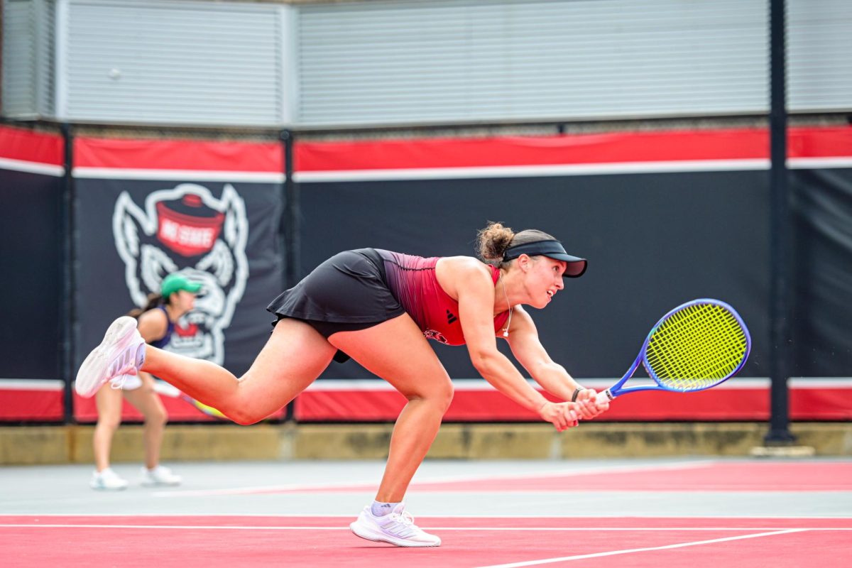 Senior Anna Zyryanova dives for the ball during the match against Notre Dame at J.W. Isenhour Tennis Center on Sunday, April 5, 2026. NC State defeated Notre Dame 4-0.