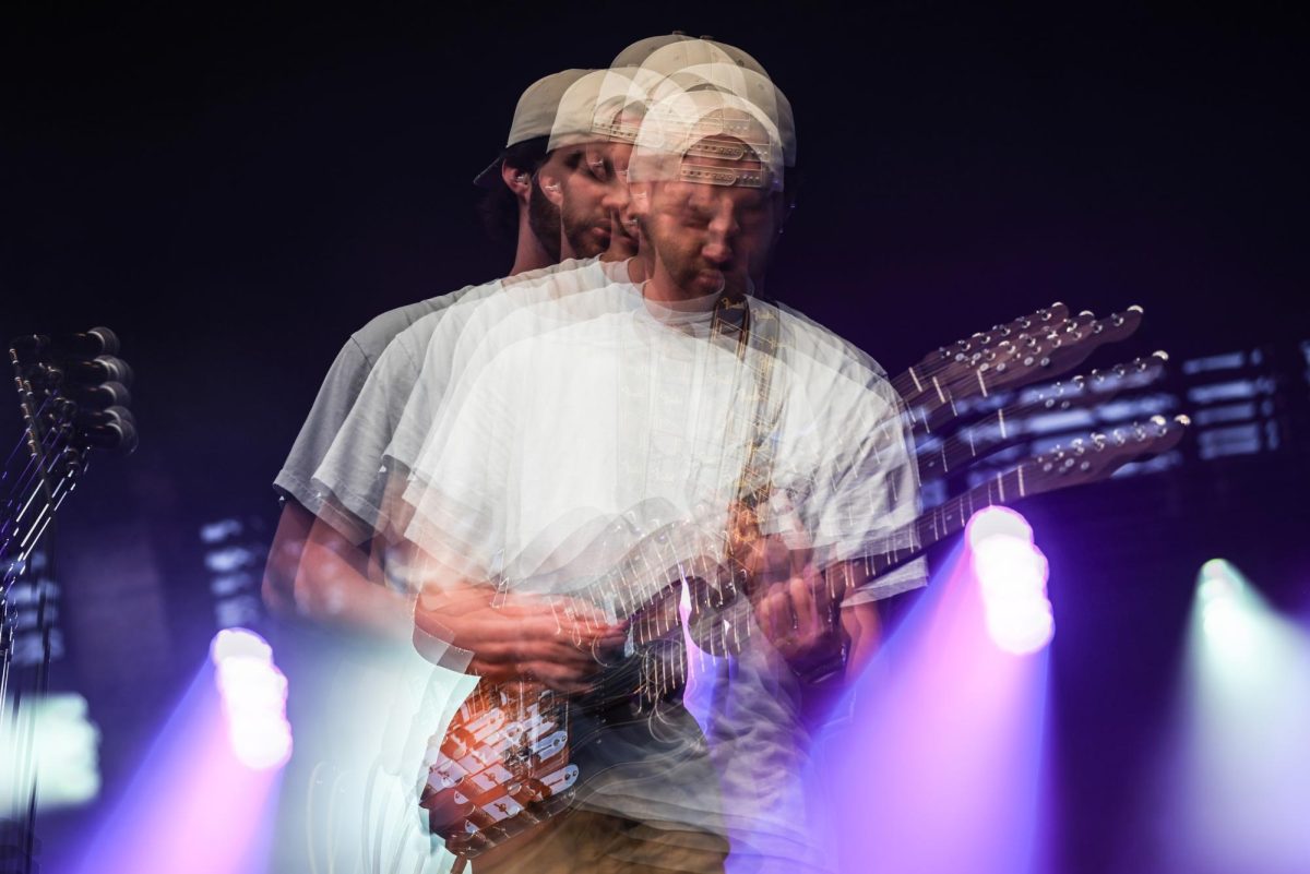 Multiple exposure image taken while Odd 39 guitarist and lead singer Jay Meland, a fourth year in the College of Sciences, hits a solo during the Wolfstock concert on Miller Fields on Saturday, April 18, 2026. Odd 39 opened for the Wolfstock concert, which also featured K-CAMP and Yung Gravy. 