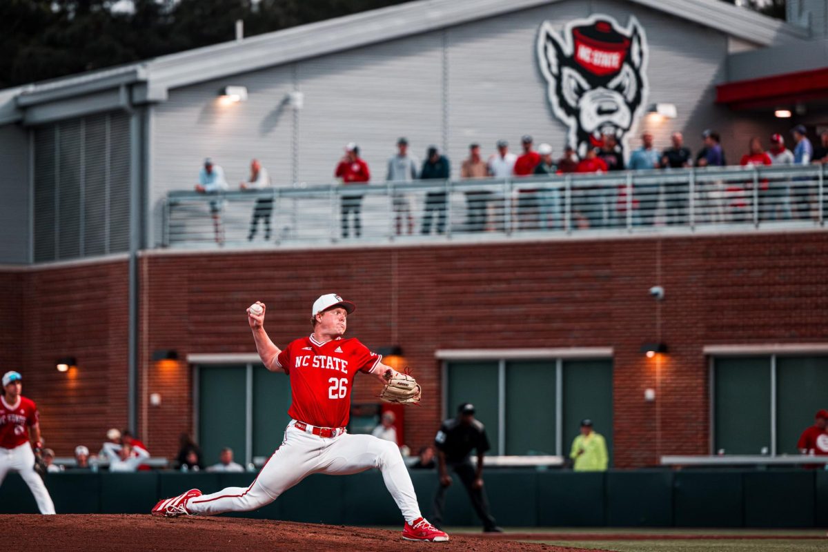 Redshirt-freshman right-hand pitcher Truitt Manuel finishes his windup to throw a pitch during the game against ECU at Doak Field at Dail Park on Tuesday, April 28, 2026. Manuel threw for 2.1 innings. The Wolfpack defeated the Pirates 12-2.