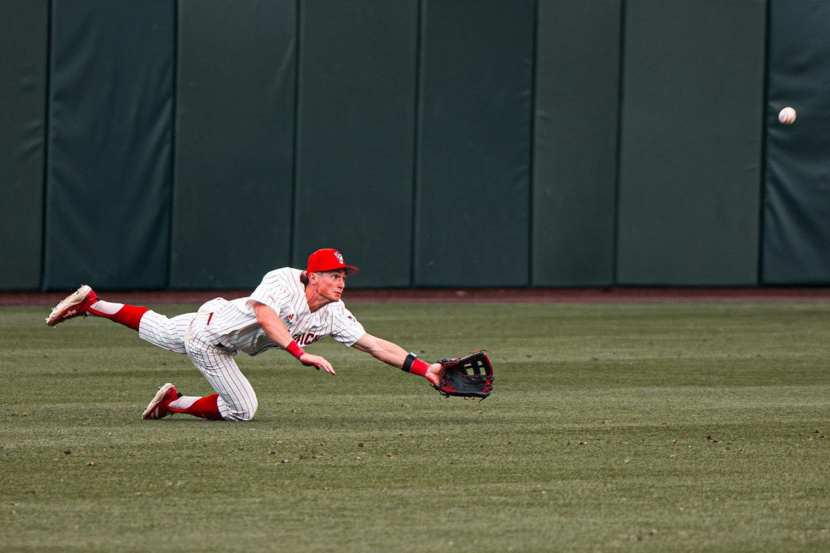 Freshmna outfielder Rett Johnson dives for the ball as it flies during the first game of the doubleheader against Miami in Doak Field at Dail Park on Friday, May 1, 2026. The Wolfpack lost to the Hurricanes 12-9.
