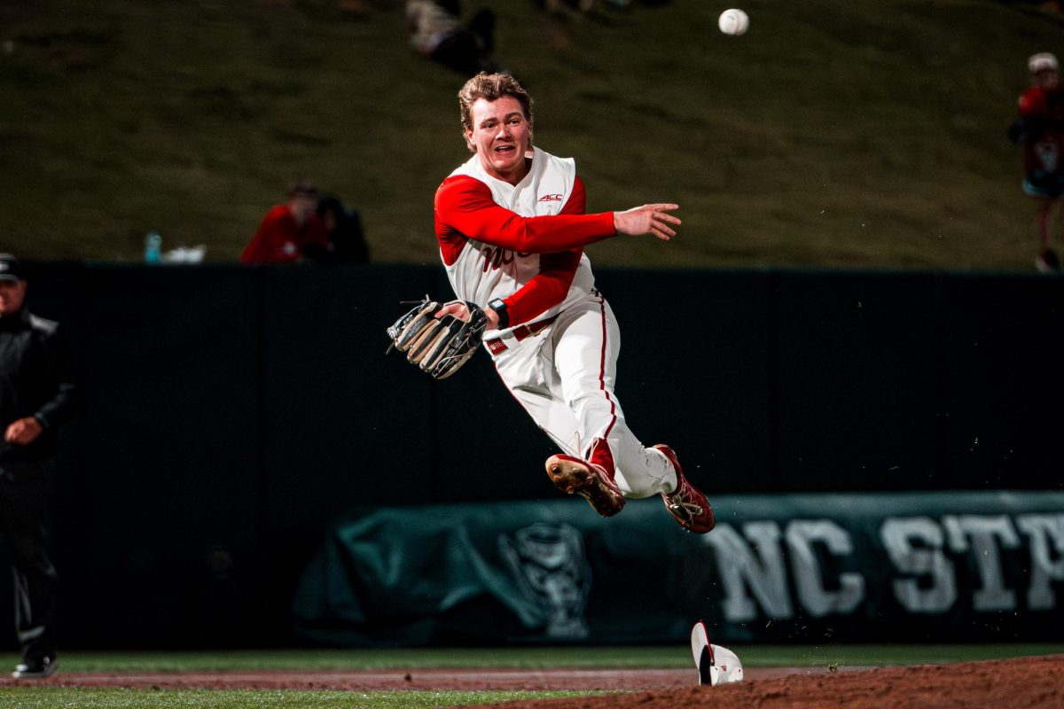 Senior infielder Wyatt Peifer throws the ball to first during the game against Miami in Doak Field at Dail Park on Saturday, May 2, 2026. The Wolfpack defeated the Hurricanes 12-7.