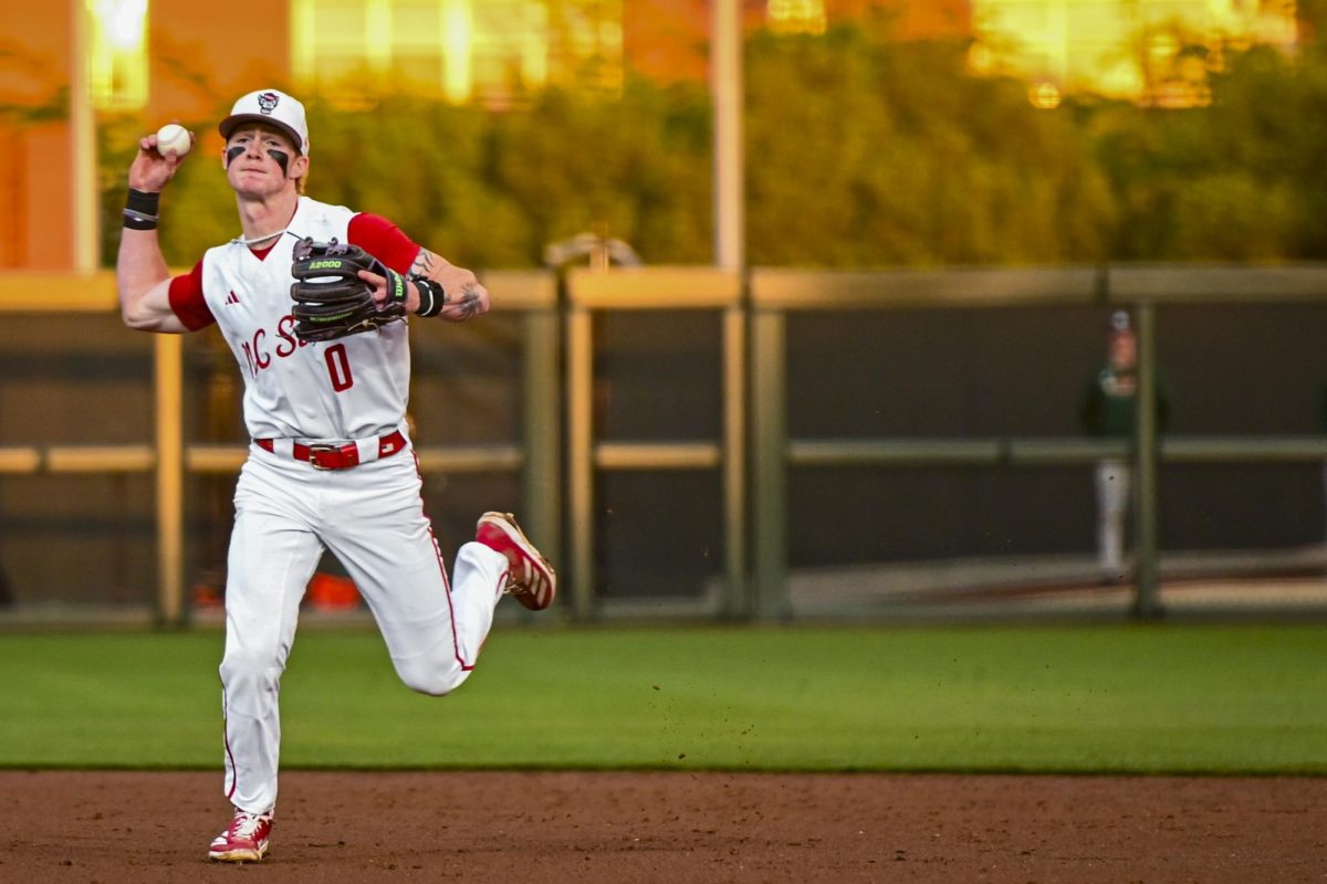 Junior infielder Luke Nixon throws to first during the game against Miami in Doak Field at Dail Park on Saturday, May 2, 2026. The Wolfpack defeated the Hurricanes 12-7.