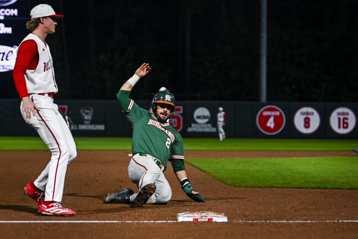 Fifth-year senior outfielder Derek Williams slides into third during the game against Miami in Doak Field at Dail Park on Saturday, May 2, 2026. The Wolfpack defeated the Hurricanes 12-7.