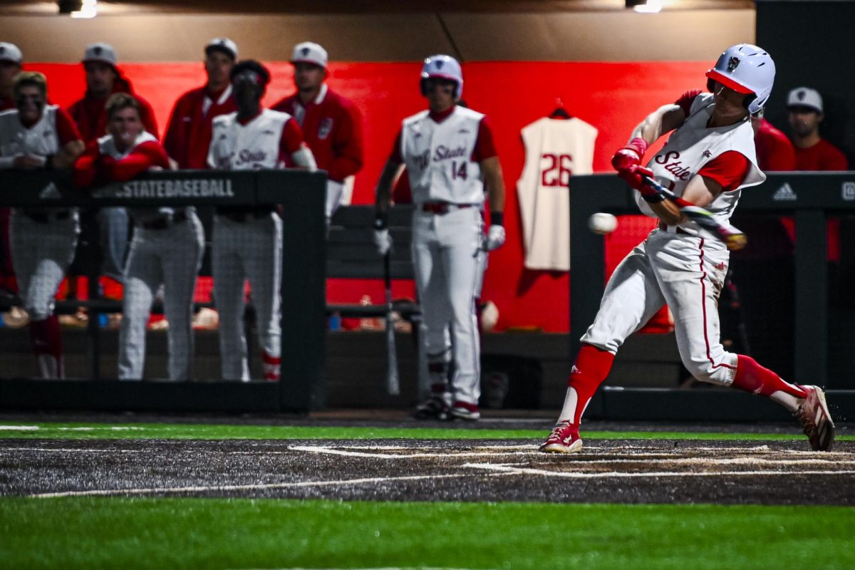 Freshman outfielder Rett Johnson strikes the ball during the game against Miami in Doak Field at Dail Park on Saturday, May 2, 2026. Johnson recorded two hits and two runs. The Wolfpack defeated the Hurricanes 12-7.