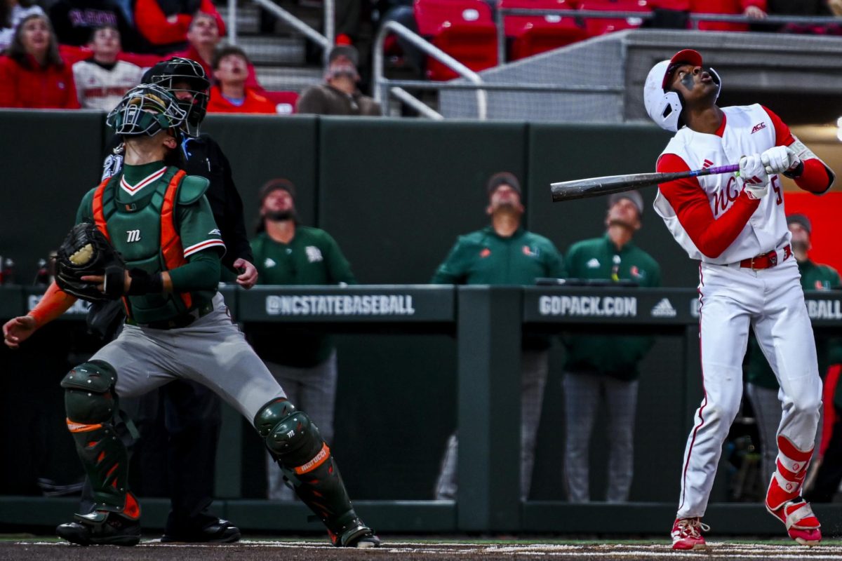 Junior infielder Sherman Johnson looks up at his fly ball during the game against Miami in Doak Field at Dail Park on Saturday, May 2, 2026. The Wolfpack defeated the Hurricanes 12-7.