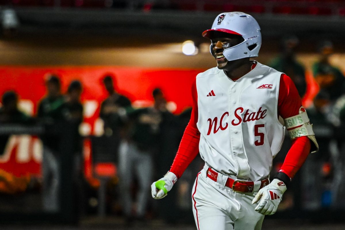 Junior infielder Sherman Johnson smiles while rounding the bases after hitting a homer during the game against Miami in Doak Field at Dail Park on Saturday, May 2, 2026. The Wolfpack defeated the Hurricanes 12-7.